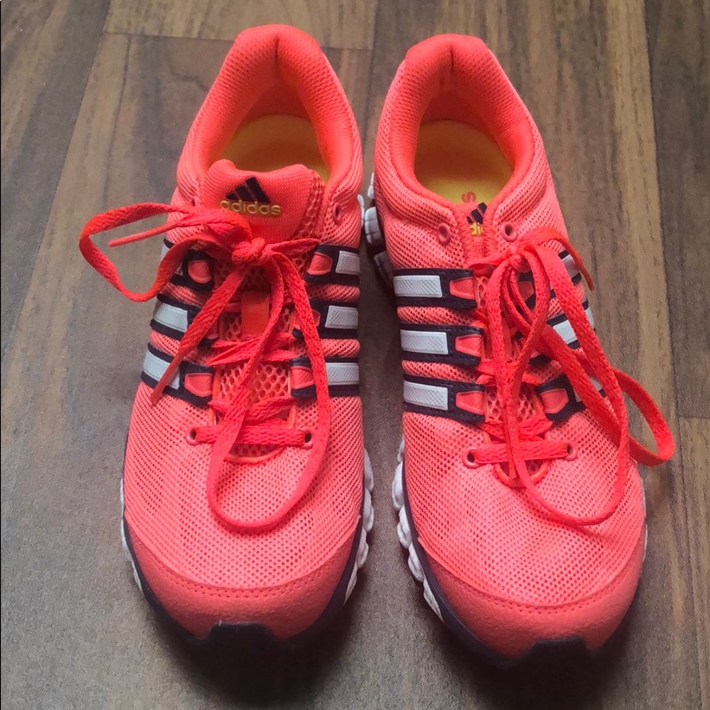 Pink adidas running shoes